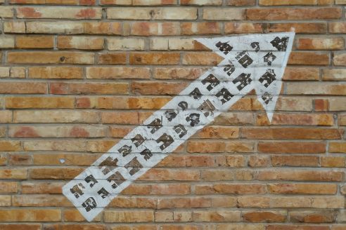 shutterstock_AI-arrow-pointing-upward-on-wall-492x328.jpg